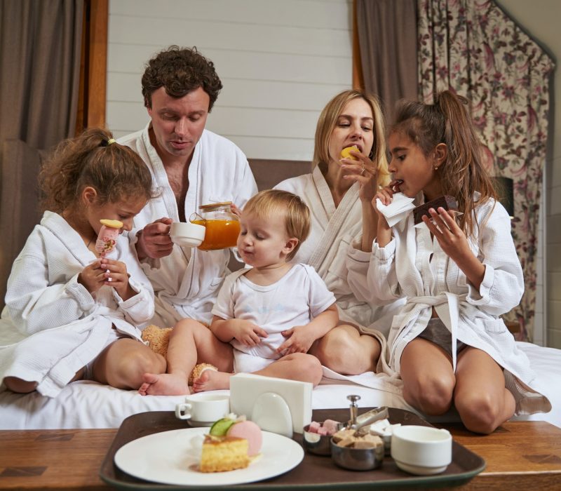 smiling-family-eating-breakfast-in-the-hotel.jpg smiling-family-eating-breakfast-in-the-hotel.jpg